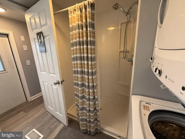 a view of a hallway with washer and dryer