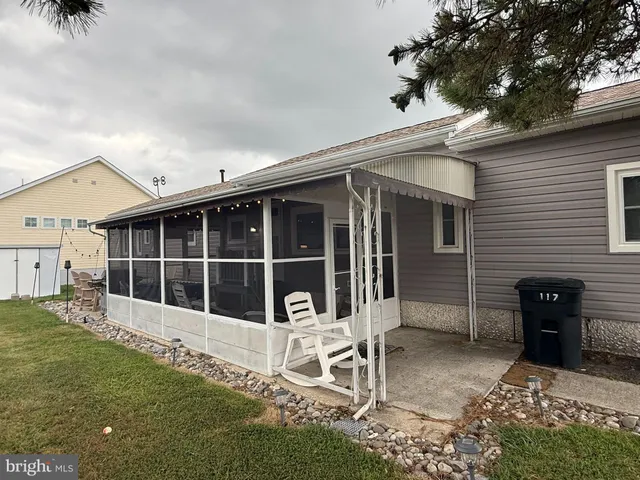 front view of a house with a large window