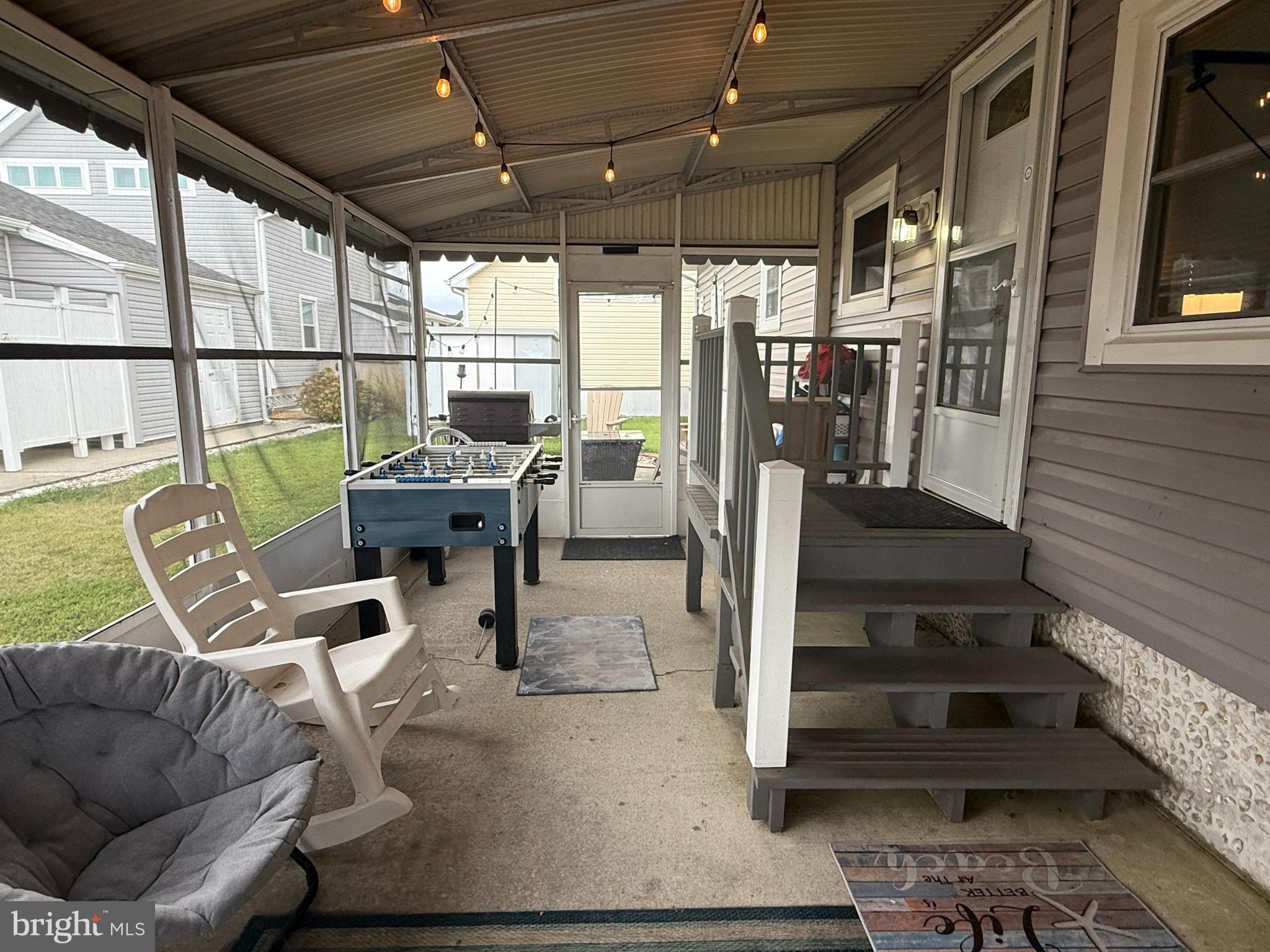 117 Clamshell Road Ocean City, MD 21842 - Photo 4 of 14 a view of a livingroom with furniture wooden floor and windows