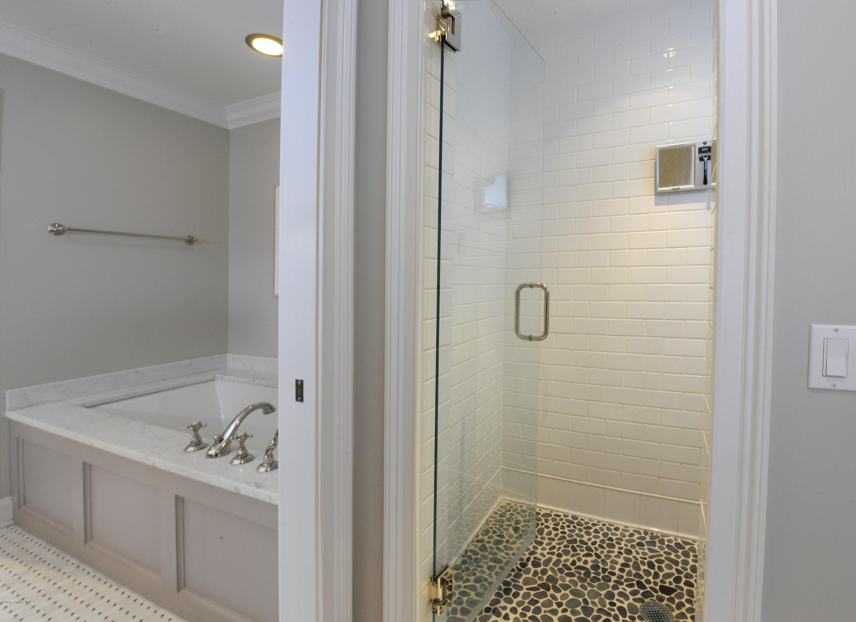 186 Field Point Road, Unit 4A Greenwich, CT 06830 - Photo 13 of 23 a bathroom with a sink and a shower