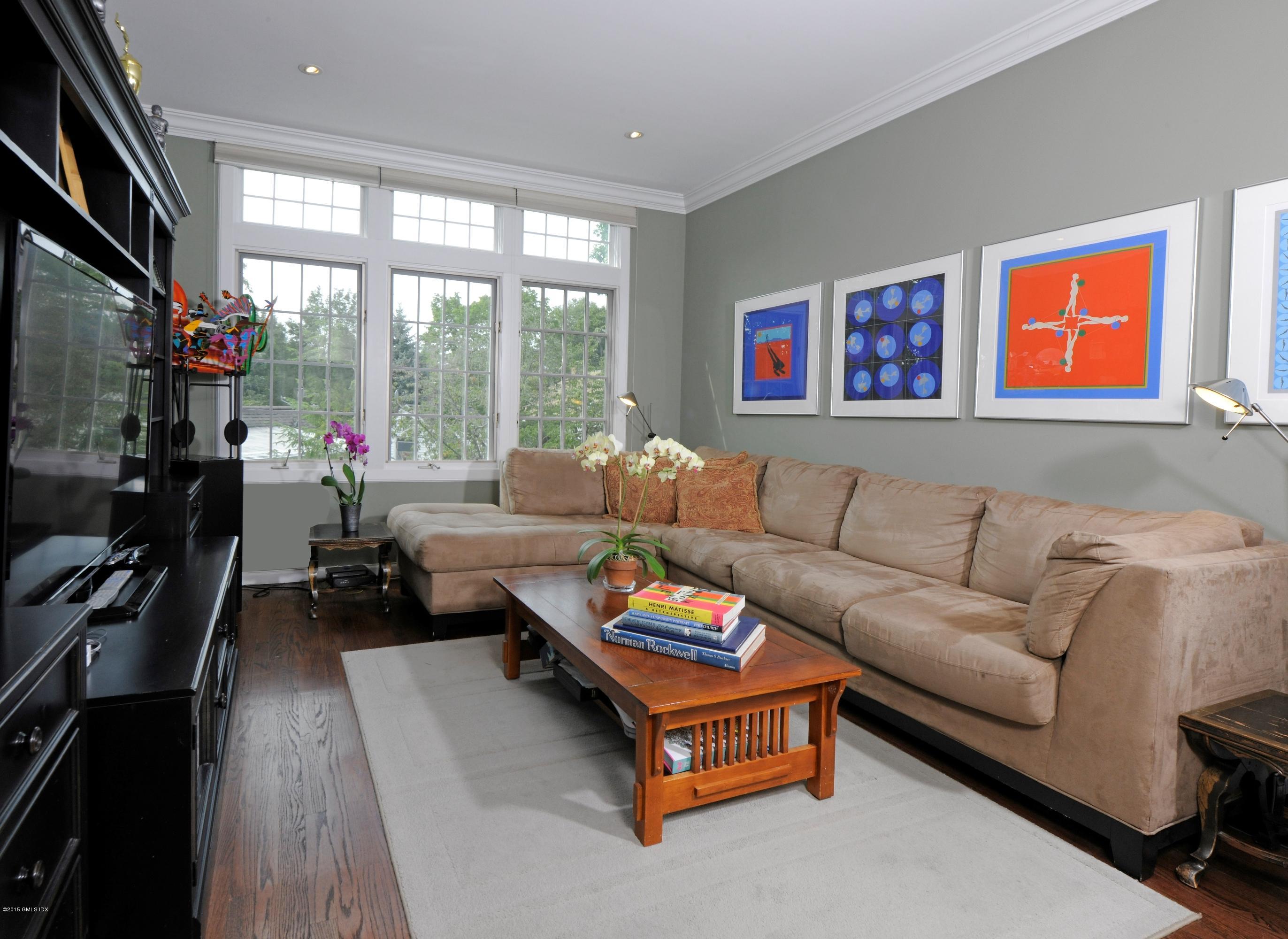 186 Field Point Road, Unit 4A Greenwich, CT 06830 - Photo 18 of 23 a living room with furniture and a flat screen tv