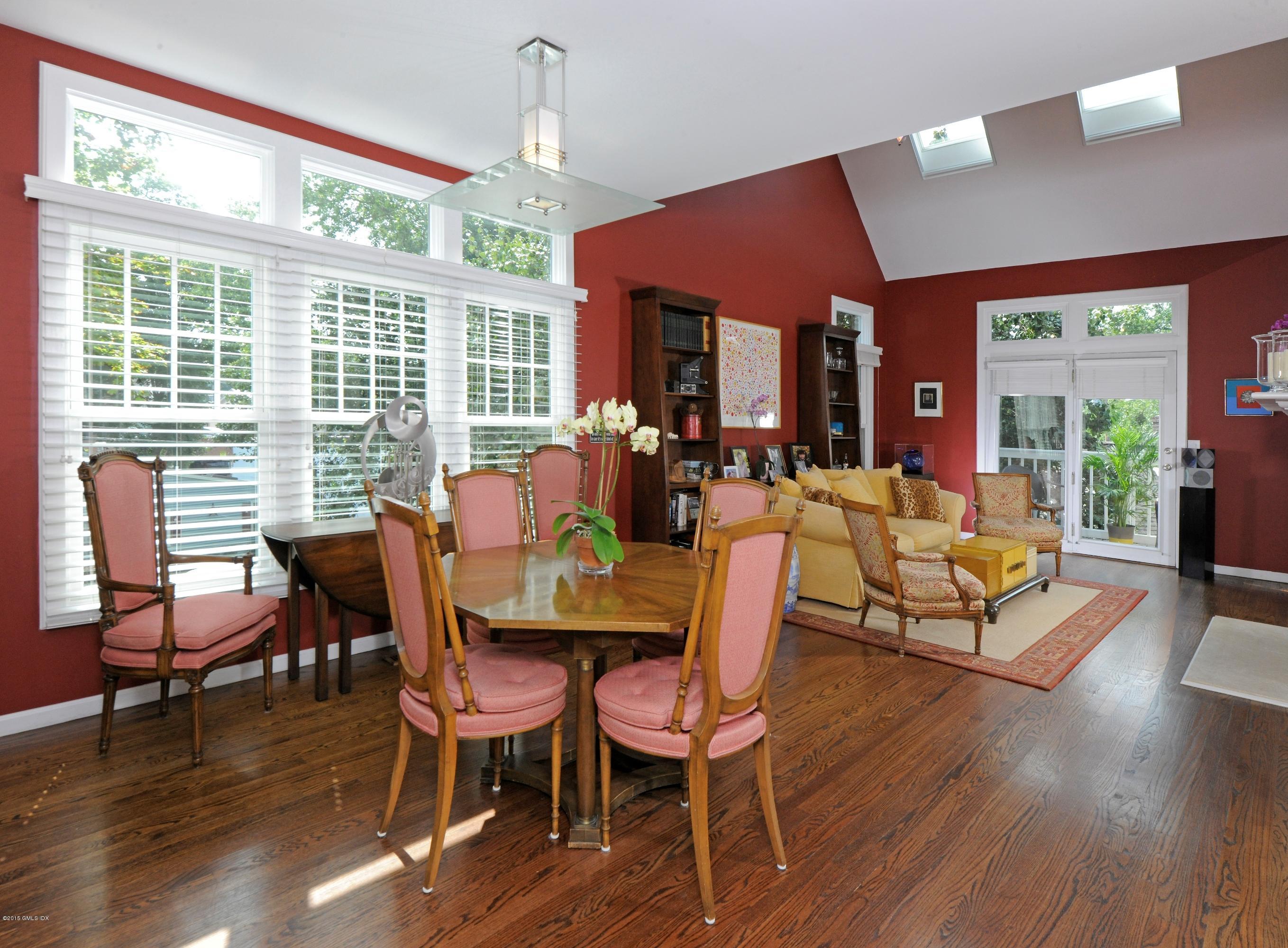 186 Field Point Road, Unit 4A Greenwich, CT 06830 - Photo 10 of 23 a dining room with furniture window and wooden floor