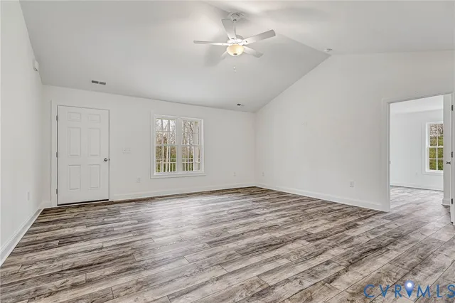 a view of an empty room with a window