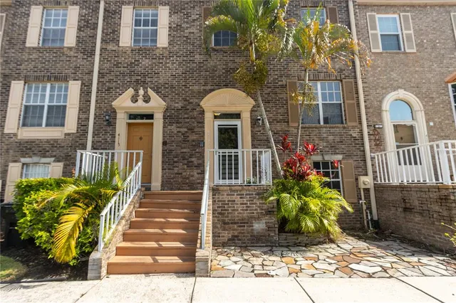 a front view of a house with yard