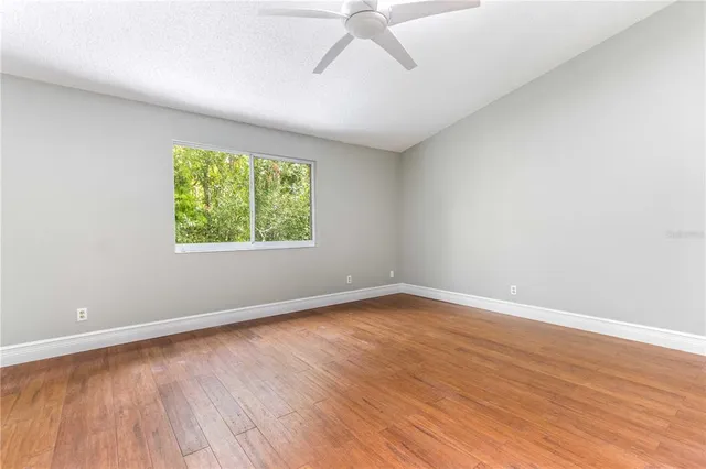 a picture of a bench in front of a wall