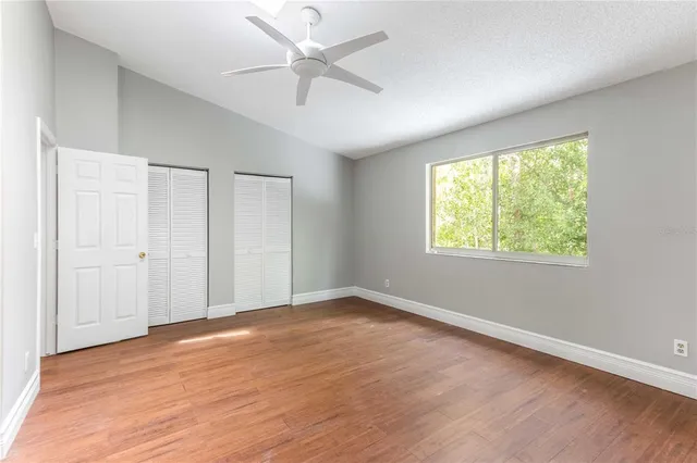 a view of a swimming pool with a yard and sitting area