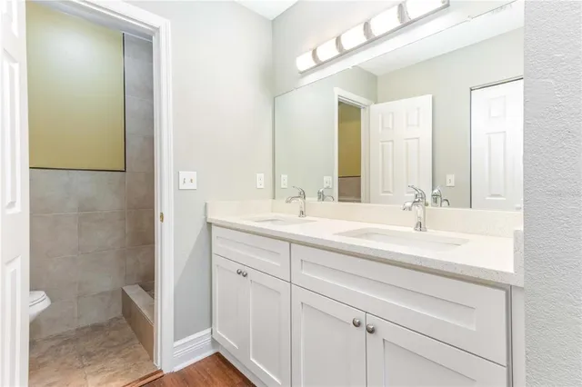 a view of park with iron fence