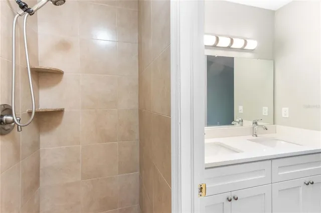 a front view of a house with garden and parking