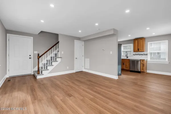 a view of a kitchen with a sink and a stove top oven