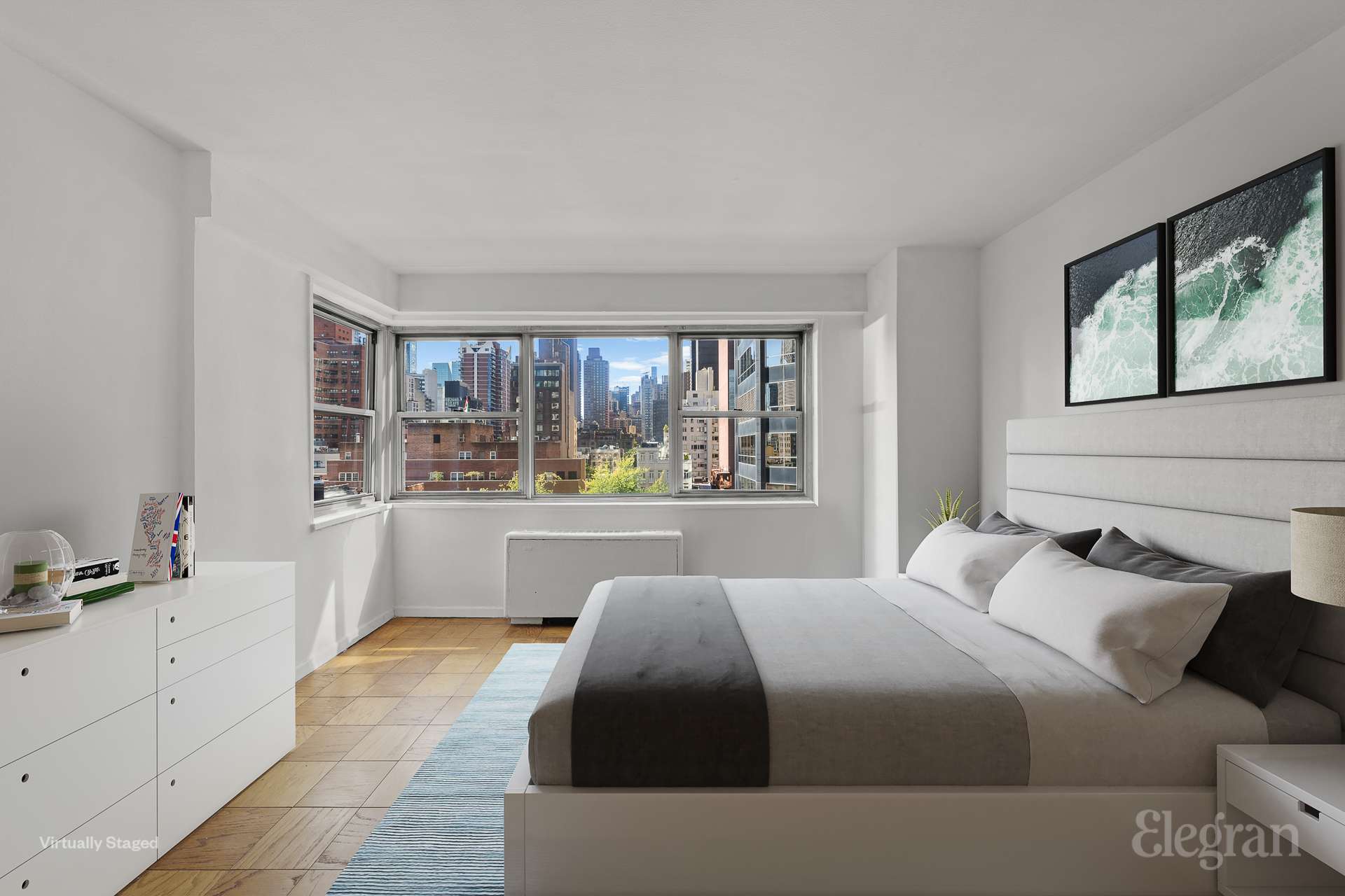 a bedroom with a large bed and a large window