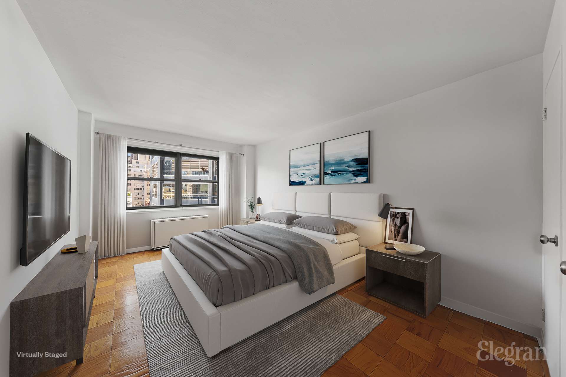 211 East 53rd Street, Unit 10F Manhattan, NY 10022 - Photo 4 of 8 a bedroom with a bed a tv and wooden floor
