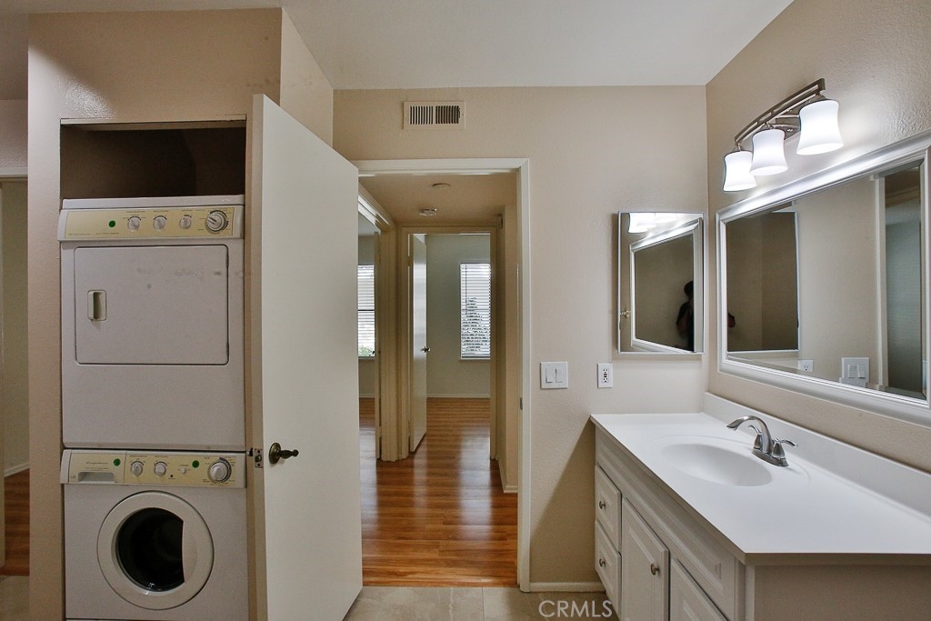 12635 Briarglen Loop, Unit G Stanton, CA 90680 - Photo 14 of 19 a view of bathroom with dual sinks
