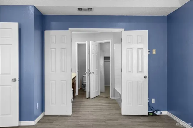 a view of a livingroom with wooden floor