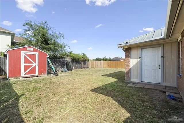 a view of a backyard of the house
