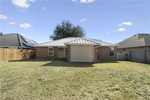 a house view with a backyard space