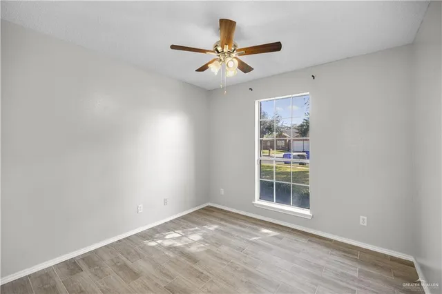 a view of an empty room with a window