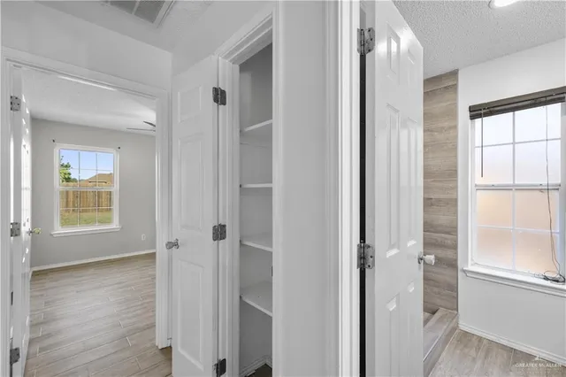 a view of a bathroom with a glass door and shower