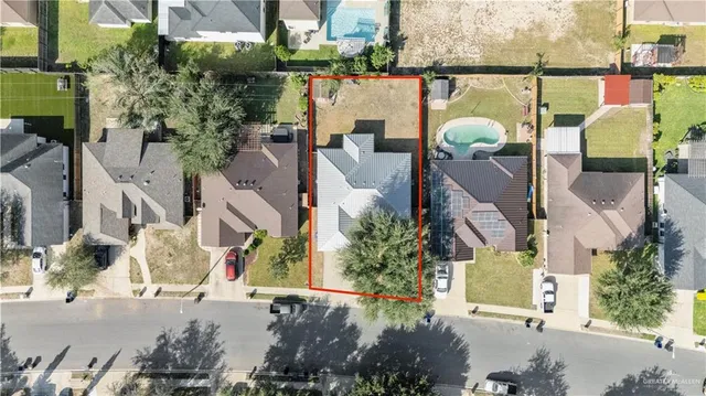 an aerial view of a house with outdoor space