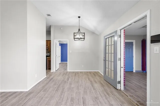 a view of a hallway view with wooden floor and staircase
