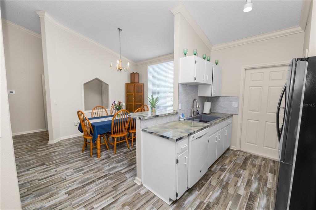 225 Lindale Street Lakeland, FL 33809 - Photo 12 of 37 a kitchen with a stove and a refrigerator