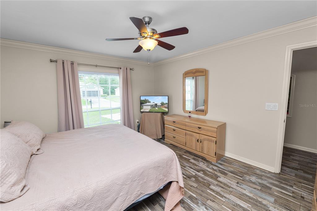 225 Lindale Street Lakeland, FL 33809 - Photo 18 of 37 a bedroom with a bed and a dresser