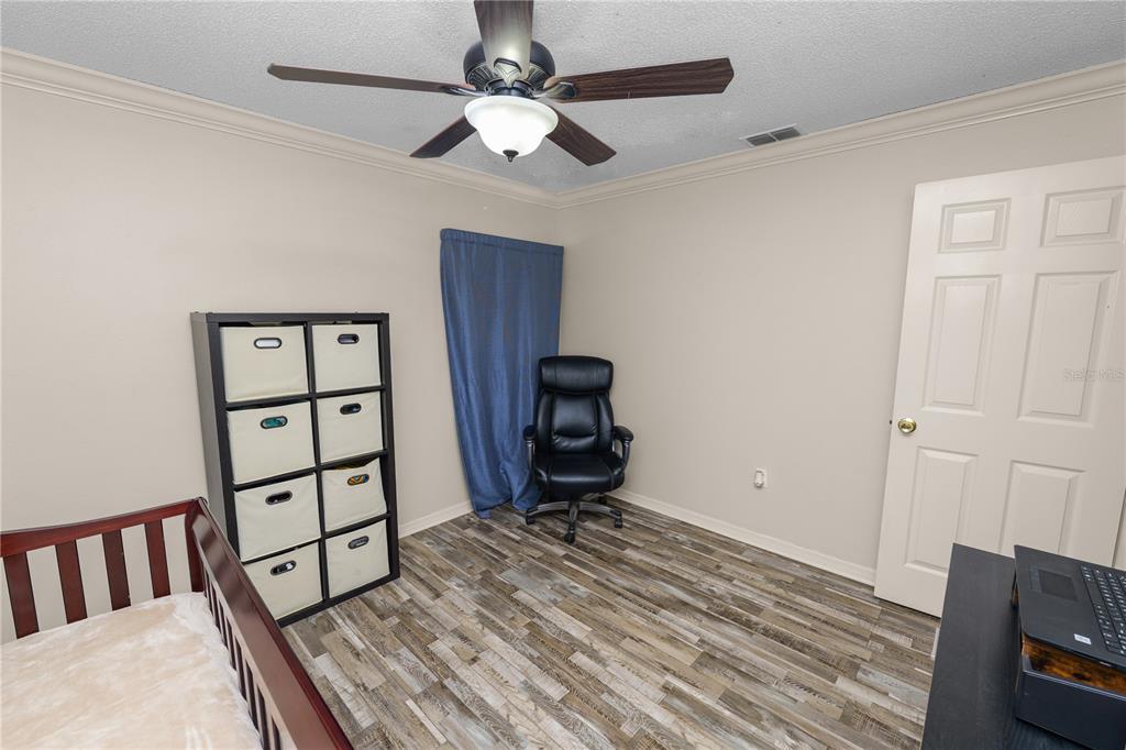 225 Lindale Street Lakeland, FL 33809 - Photo 22 of 37 a view of a hallway with wooden floor and closet