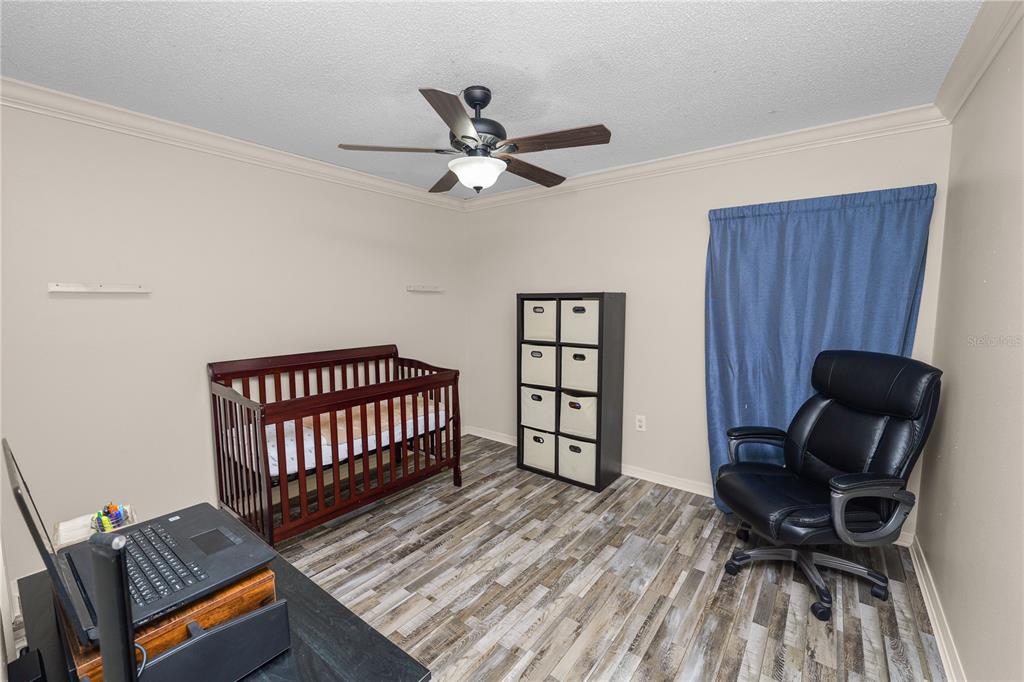 225 Lindale Street Lakeland, FL 33809 - Photo 23 of 37 a bedroom with furniture and a window