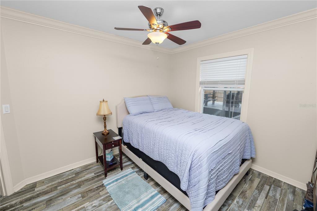 225 Lindale Street Lakeland, FL 33809 - Photo 25 of 37 a bedroom with a bed and a ceiling fan