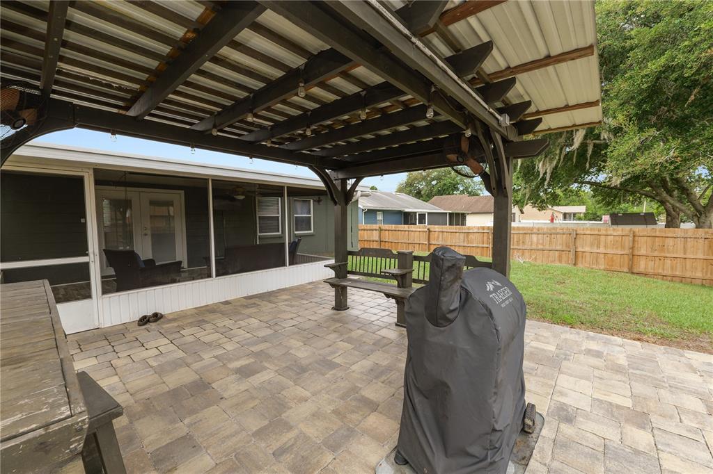 225 Lindale Street Lakeland, FL 33809 - Photo 29 of 37 a view of a porch with a table and chairs
