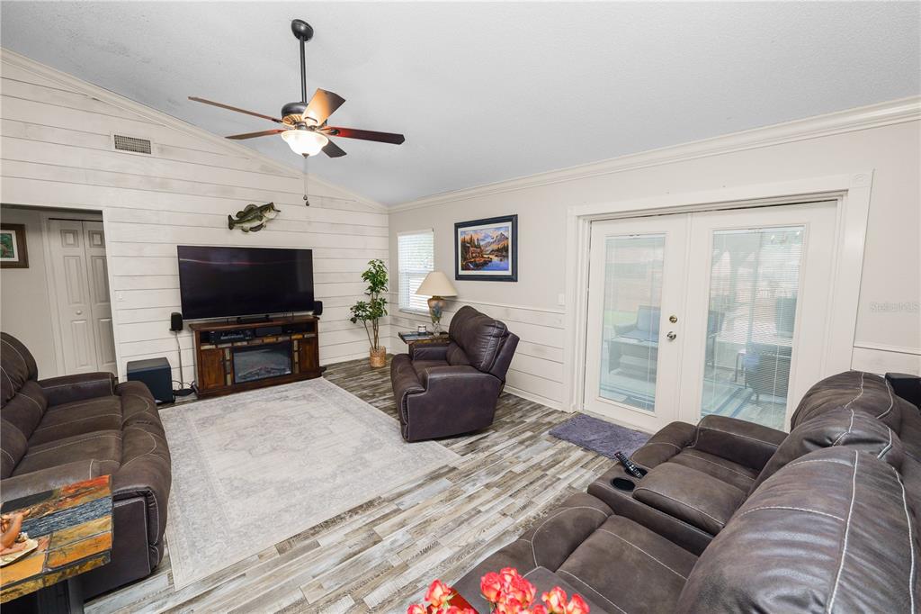 225 Lindale Street Lakeland, FL 33809 - Photo 7 of 37 a living room with furniture and a flat screen tv