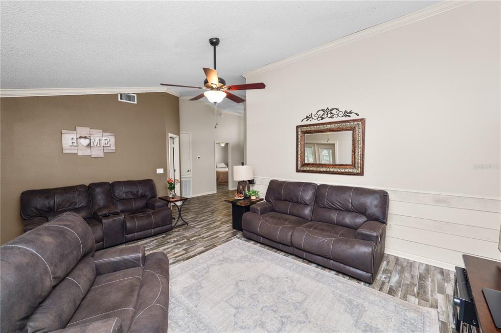 225 Lindale Street Lakeland, FL 33809 - Photo 9 of 37 a living room with furniture and a couch