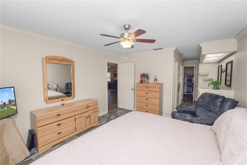 225 Lindale Street Lakeland, FL 33809 - Photo 10 of 37 a bedroom with furniture and a mirror