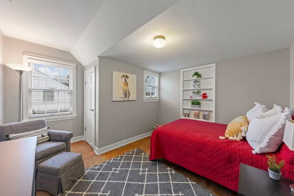 a view of a house with a garage and yard