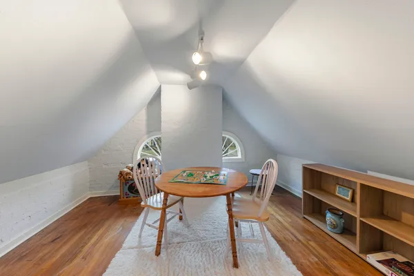 an aerial view of residential houses with city view