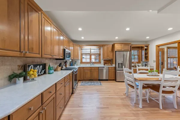 a living room with patio furniture and a large window