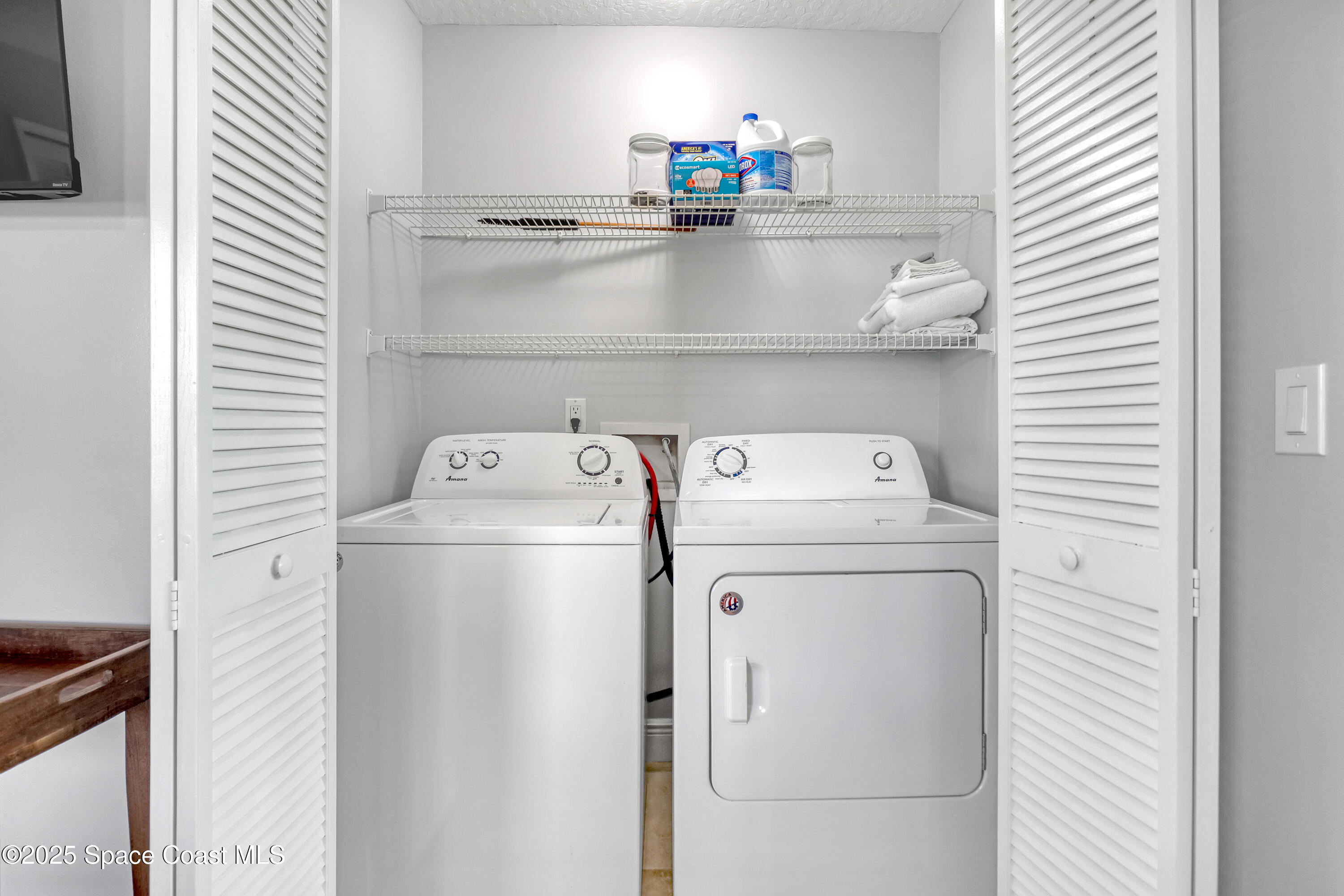 7667 North Wickham Road, Unit 224 Melbourne, FL 32940 - Photo 17 of 32 a utility room with dryer and washer