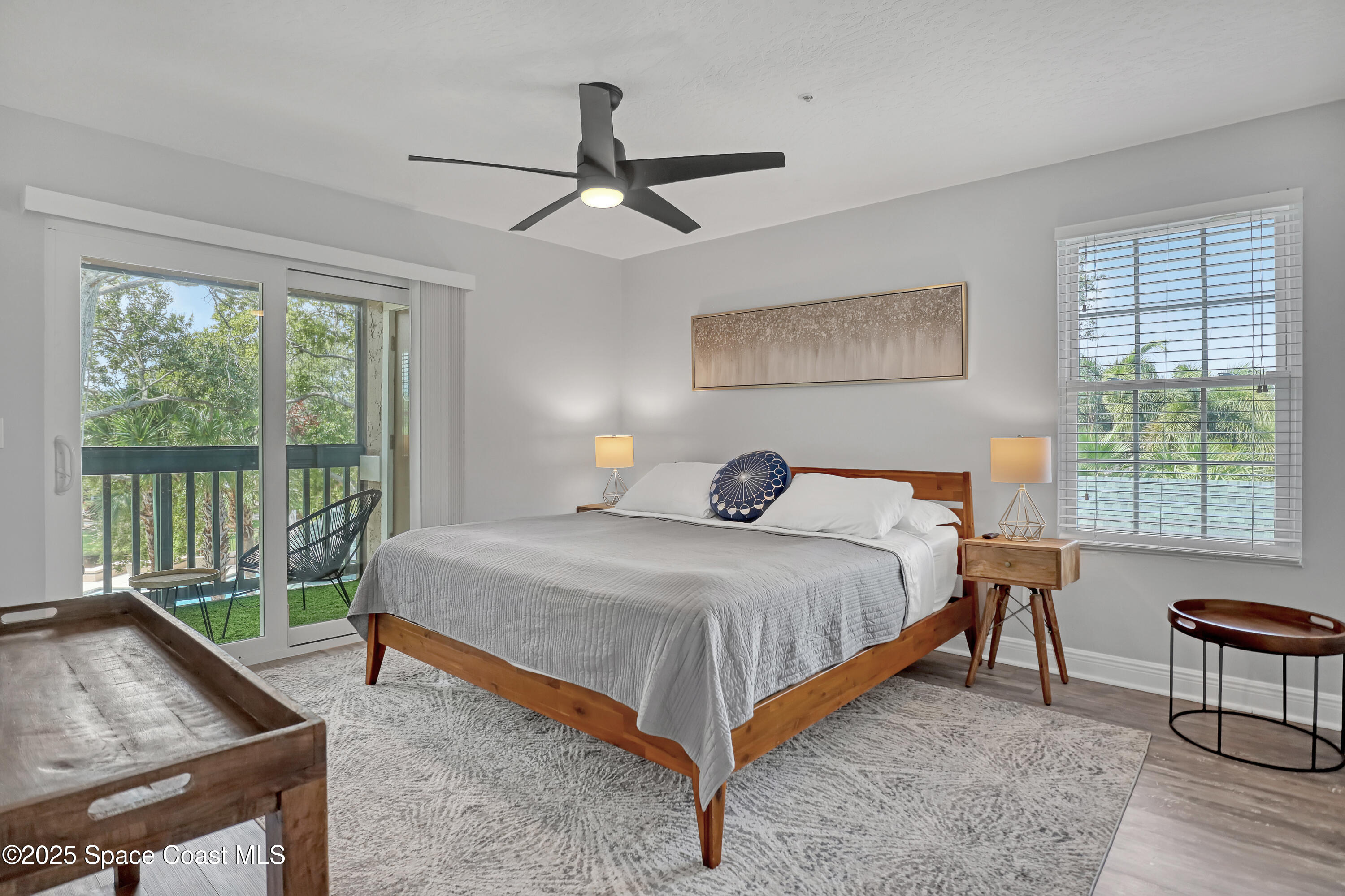 7667 North Wickham Road, Unit 224 Melbourne, FL 32940 - Photo 18 of 32 a bedroom with a bed and a window