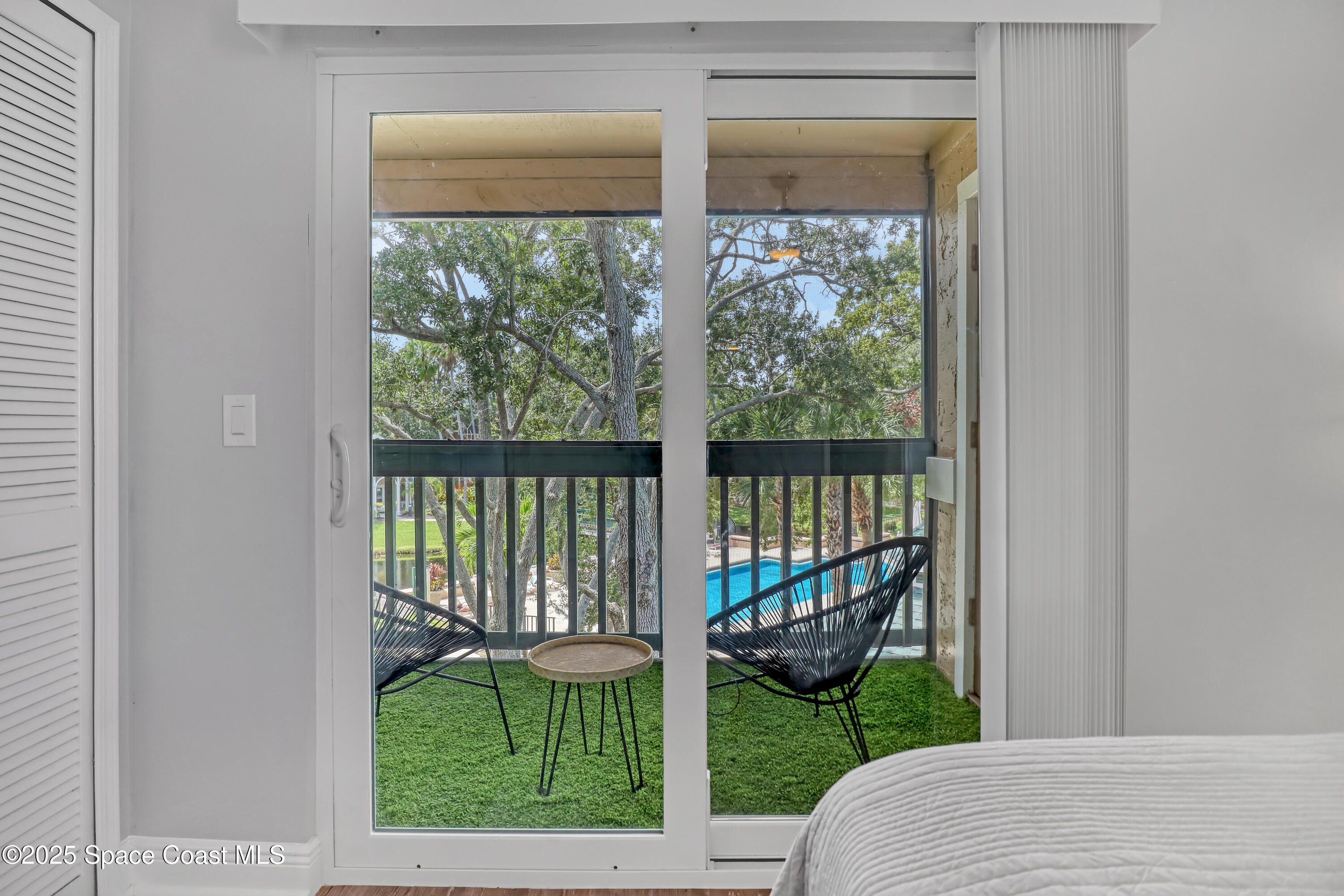 7667 North Wickham Road, Unit 224 Melbourne, FL 32940 - Photo 19 of 32 a balcony view with a garden space