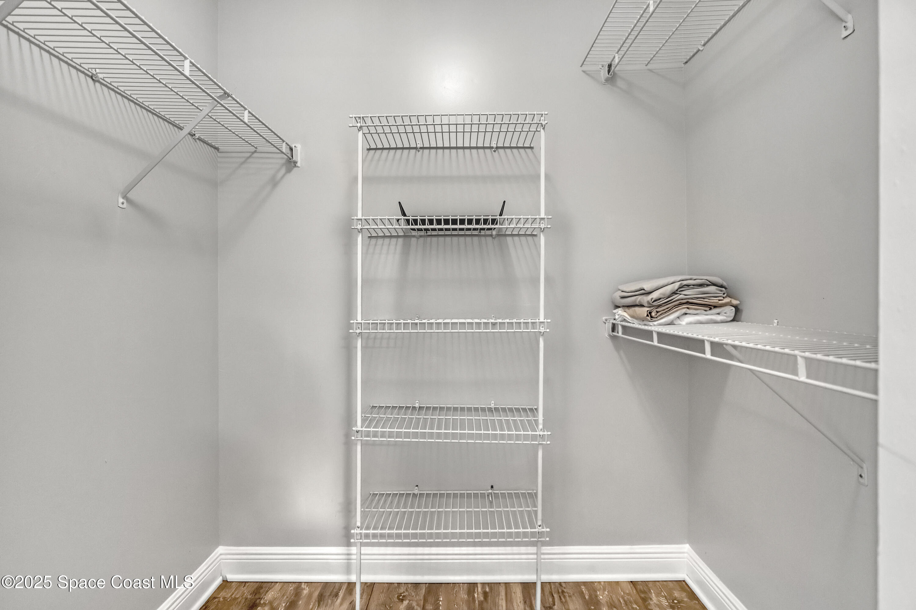 7667 North Wickham Road, Unit 224 Melbourne, FL 32940 - Photo 21 of 32 a view of walk in closet with empty racks