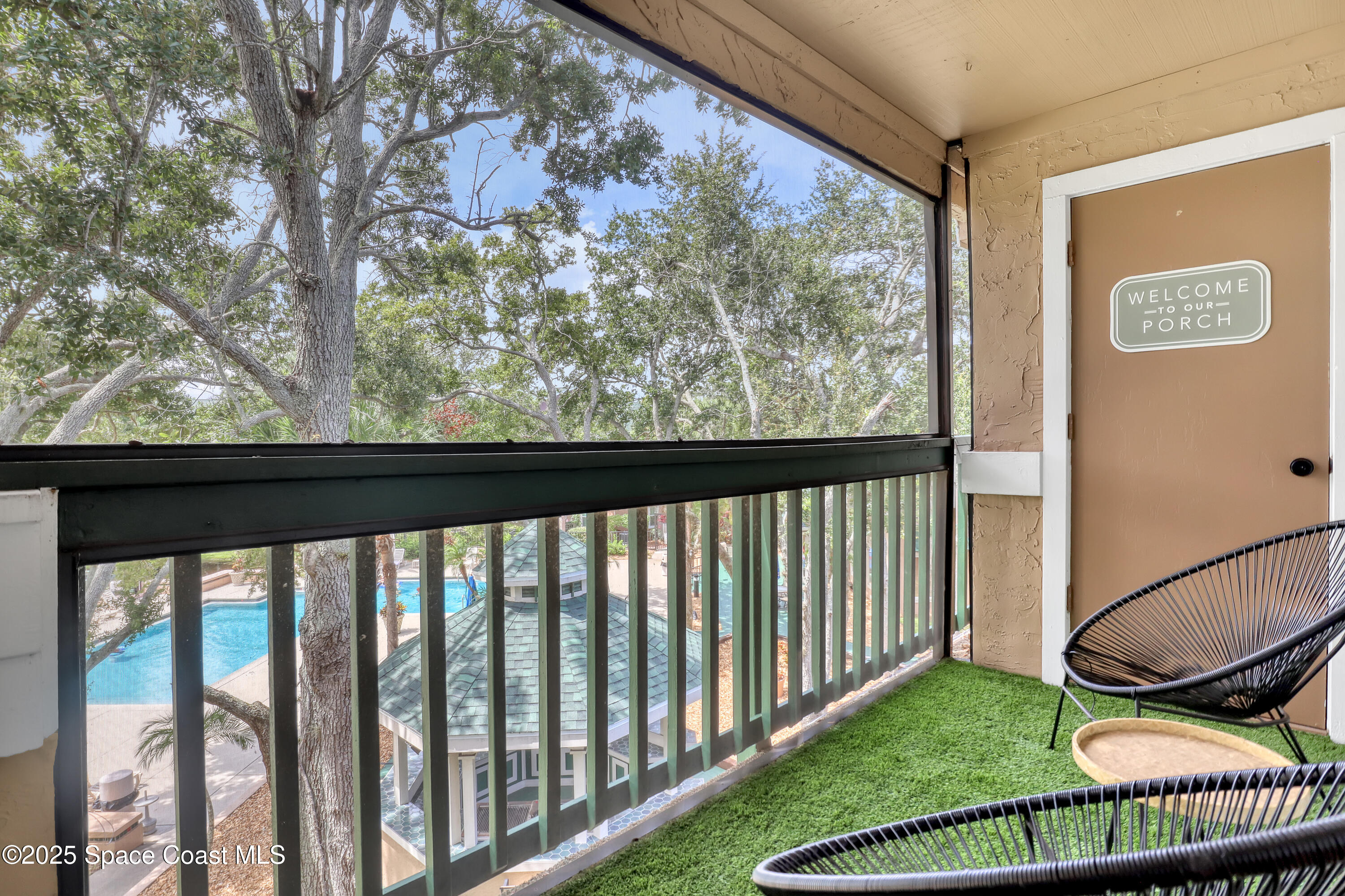 7667 North Wickham Road, Unit 224 Melbourne, FL 32940 - Photo 23 of 32 a view of a porch with a yard