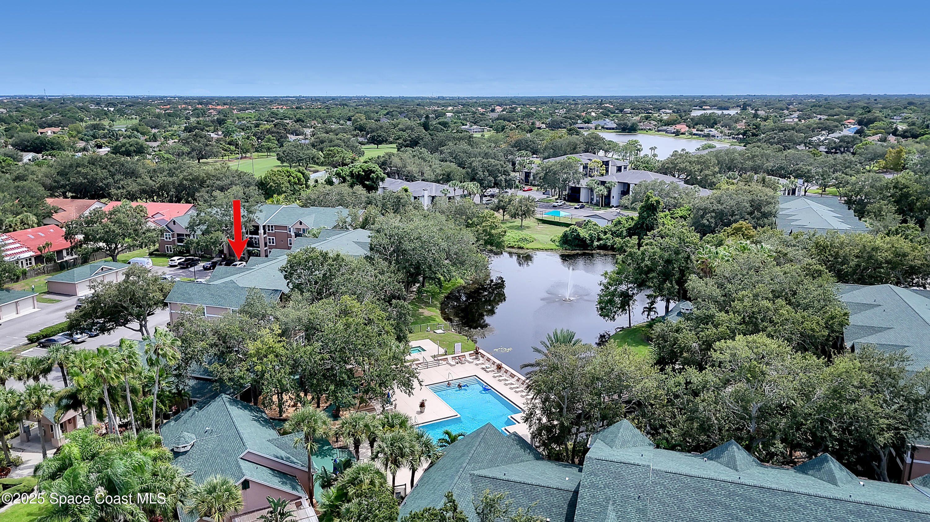 7667 North Wickham Road, Unit 224 Melbourne, FL 32940 - Photo 32 of 32 an aerial view of a houses with outdoor space and street view