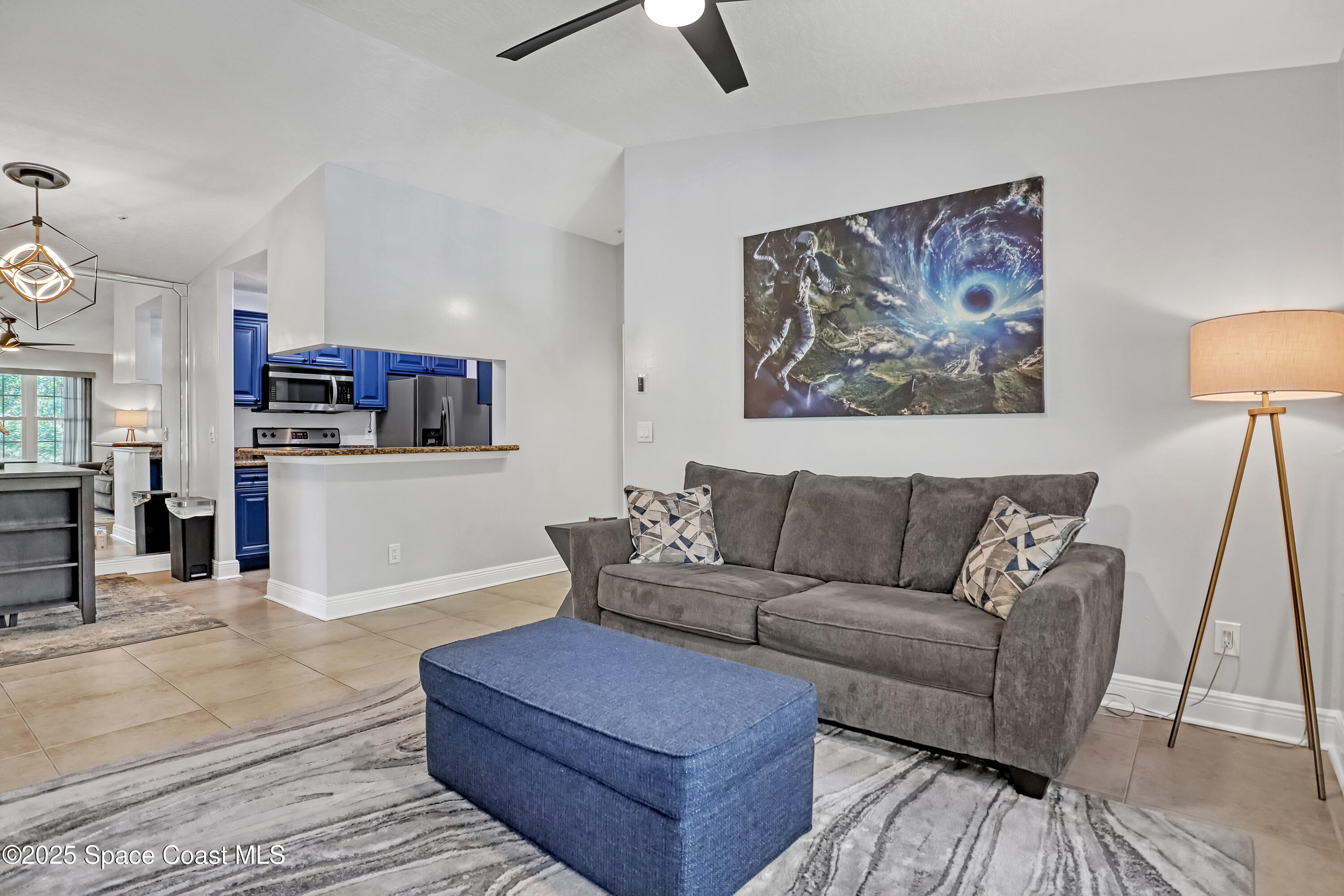 7667 North Wickham Road, Unit 224 Melbourne, FL 32940 - Photo 10 of 32 a living room with furniture and a couch