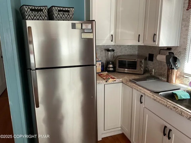 a bedroom with a bed and a night stand