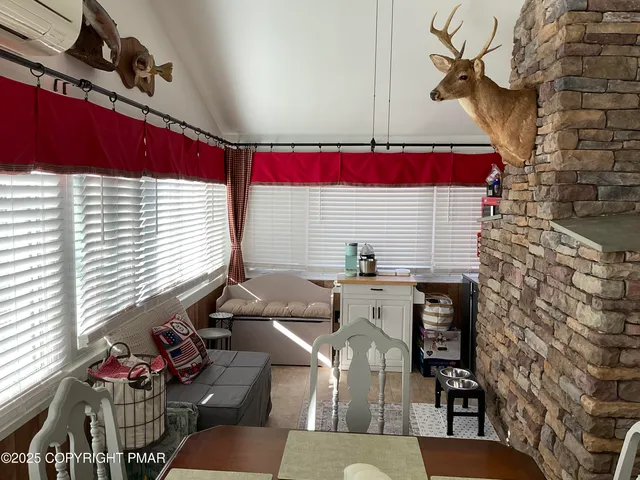 a view of a dinning tables and chairs in a patio