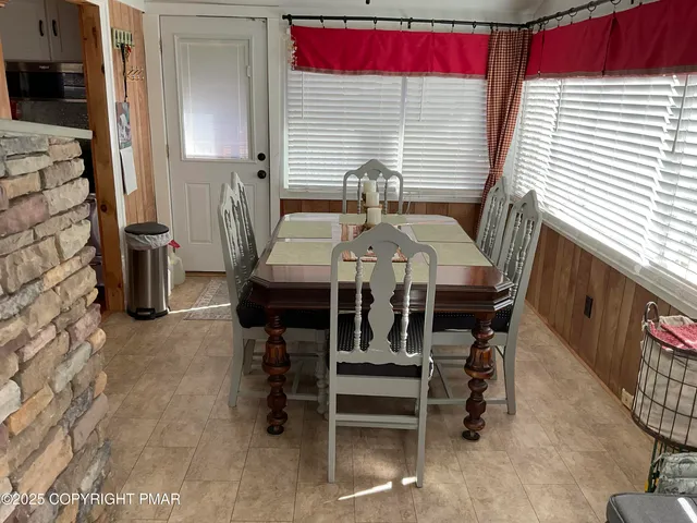 a view of a tree with a house in front of it