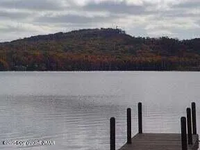 a view of a lake with table and chair