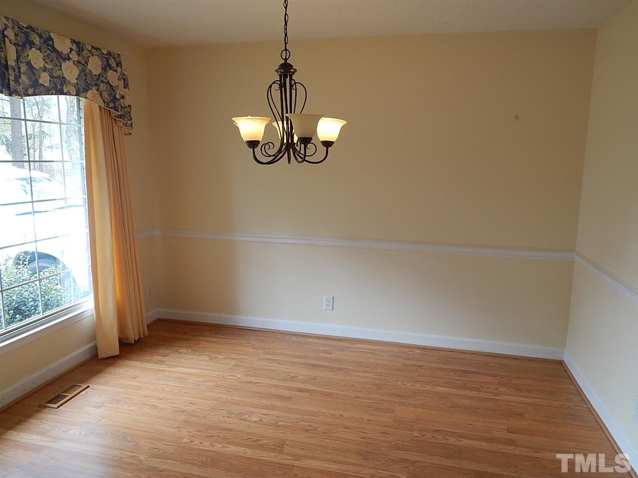 1427 Torredge Road Durham, NC 27712 - Photo 2 of 17 a view of empty room with wooden floor and window