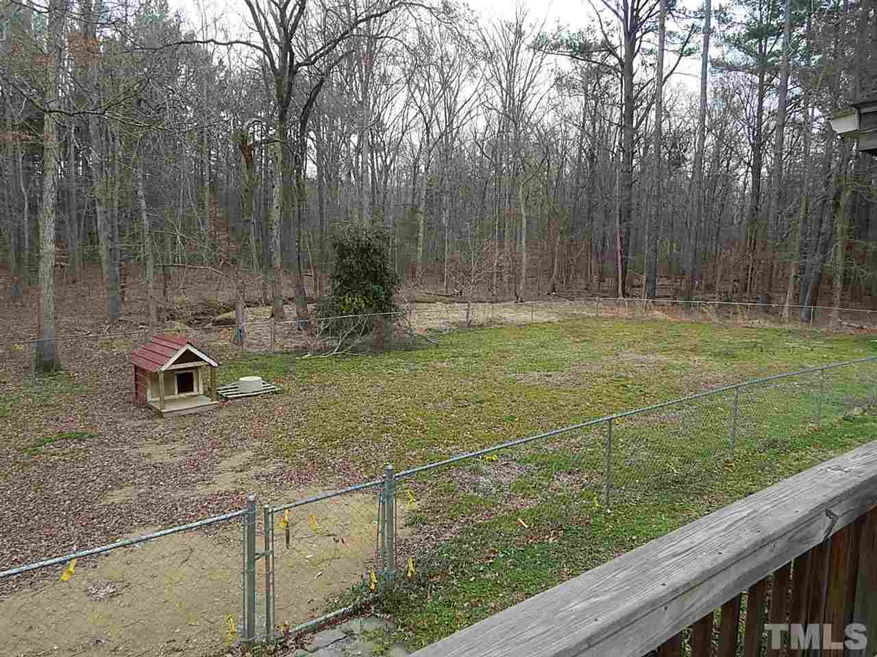 1427 Torredge Road Durham, NC 27712 - Photo 17 of 17 a backyard of a house with lots of green space
