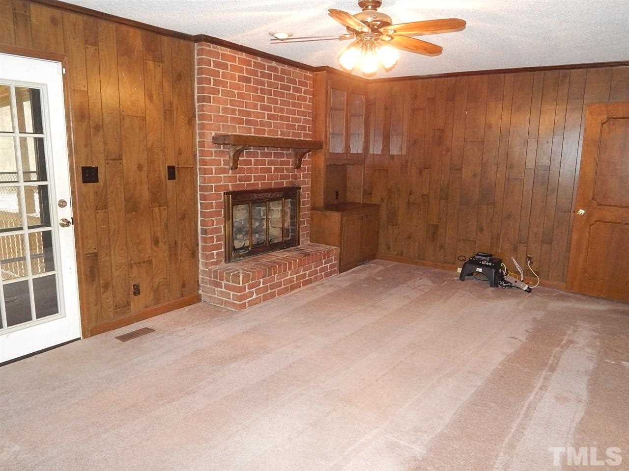1427 Torredge Road Durham, NC 27712 - Photo 4 of 17 a view of a livingroom with a fireplace