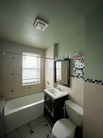 a bathroom with a sink toilet and bathtub
